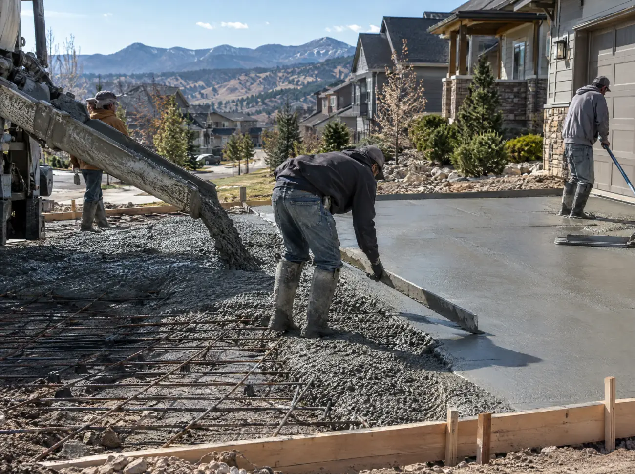Castle Rock concrete: finishers pouring and screeding a new driveway